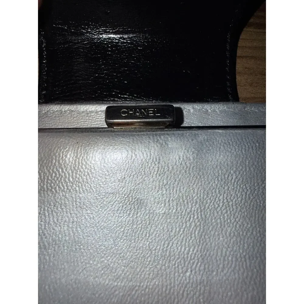 Chanel Icon Symbols Bifold Wallet Black Embossed Metallic Silver Kiss Lock